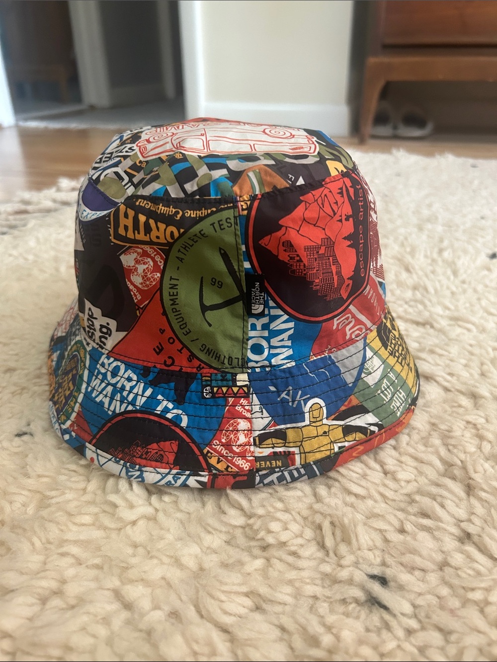 The North Face, reversible,  “Sticker Bomb”/“Base Camp” -Print Bucket Hat
